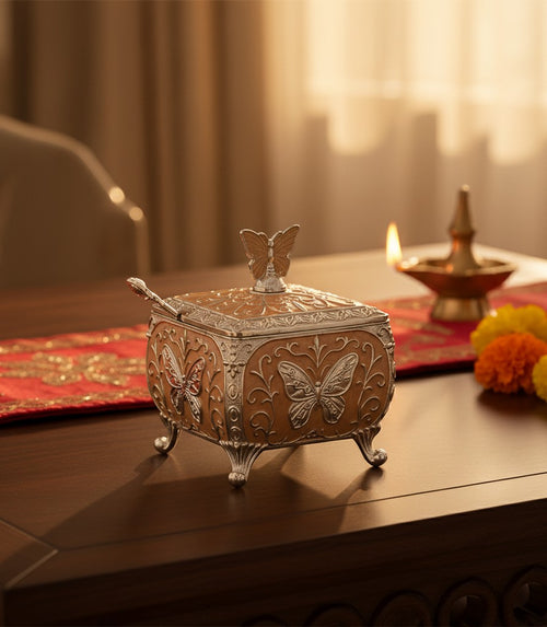 Art N Soul German silver butterfly decorative storage box with a warm enamel finish on a wooden table