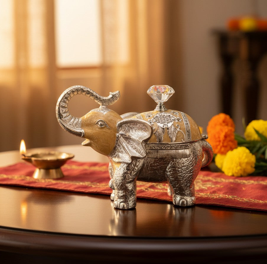 Art N Soul German silver elephant storage box with enamel detail and crystal knob on a table with marigold flowers