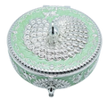 Round German silver storage box with a peacock finial and embossed filigree body.