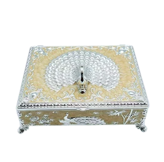 Square German silver storage box with a peacock finial and embossed filigree detailing.