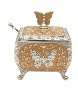 German silver butterfly storage box with a warm enamel body and butterfly finial.